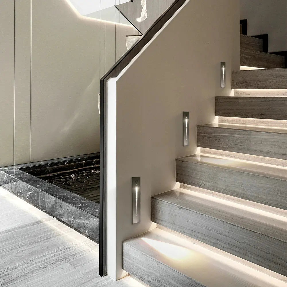 SANDIY smart stair lighting wall lamps, three silver motion-sensor step lights mounted along a modern staircase