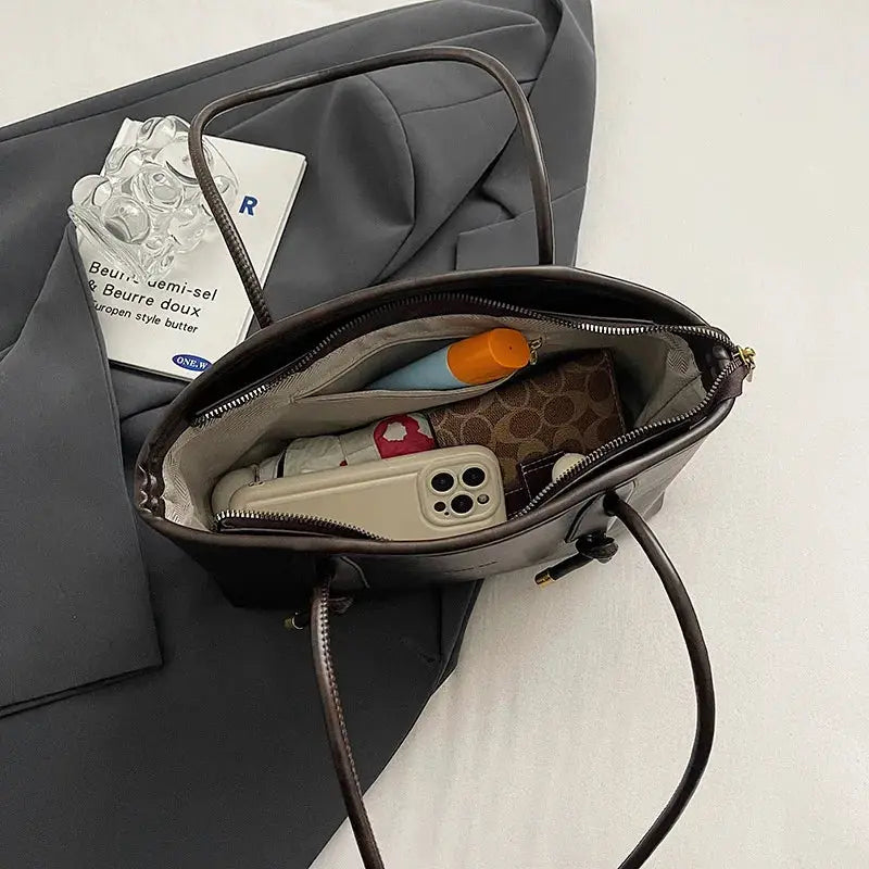 PU leather shoulder bag for women, brown crossbody with zipper, interior shows phone and wallet