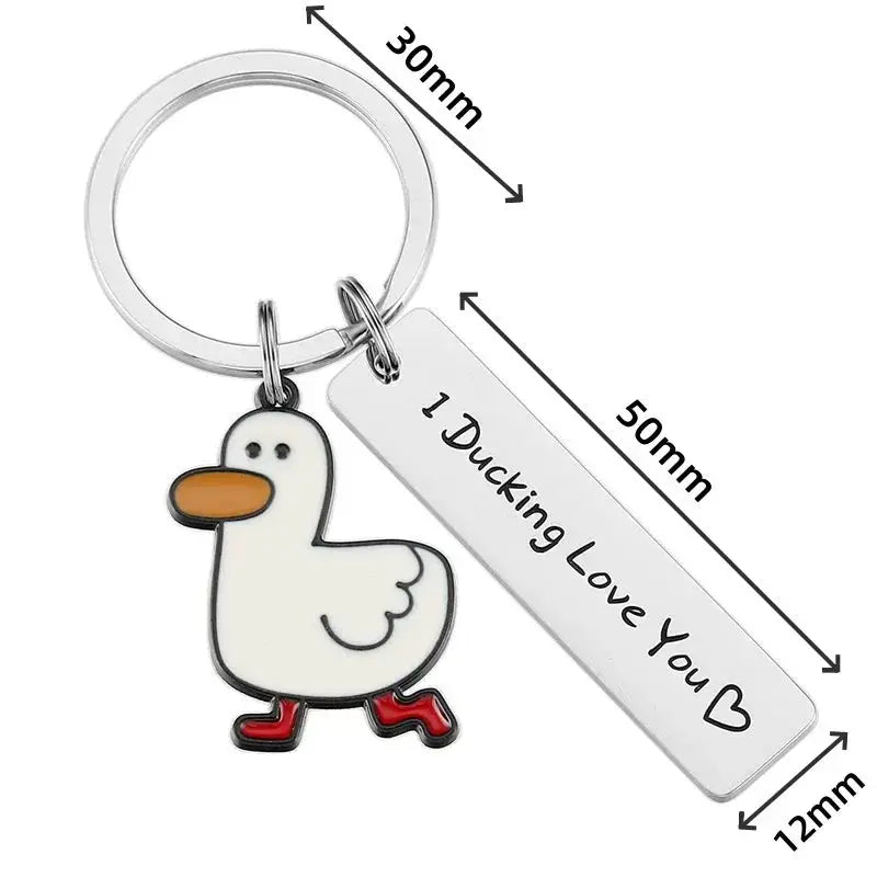 Funny duck keychain with white duck charm, orange beak, red feet, and silver engraved tag reading 1 Ducking Love You