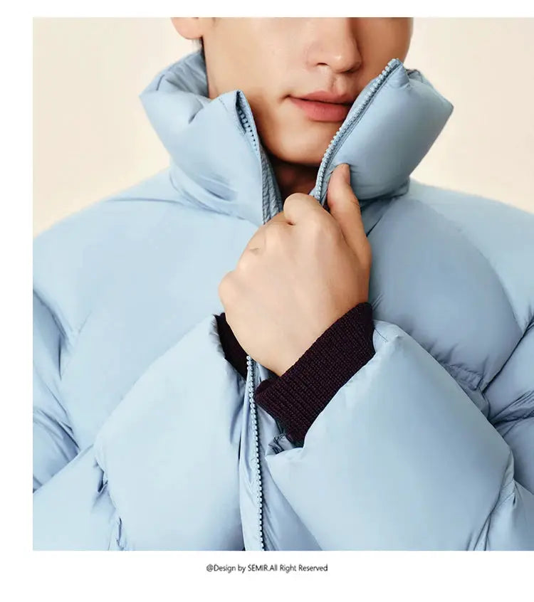 Semir down jacket; light blue unisex puffer coat with high collar and zip closure.