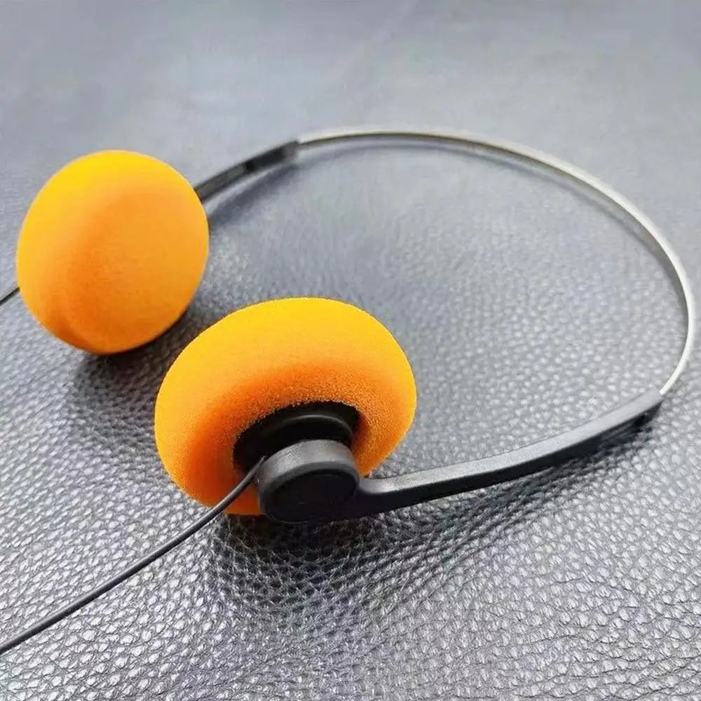Simples Market on-ear wired stereo headphones with orange foam cushions, adjustable headband, 3.5mm plug.