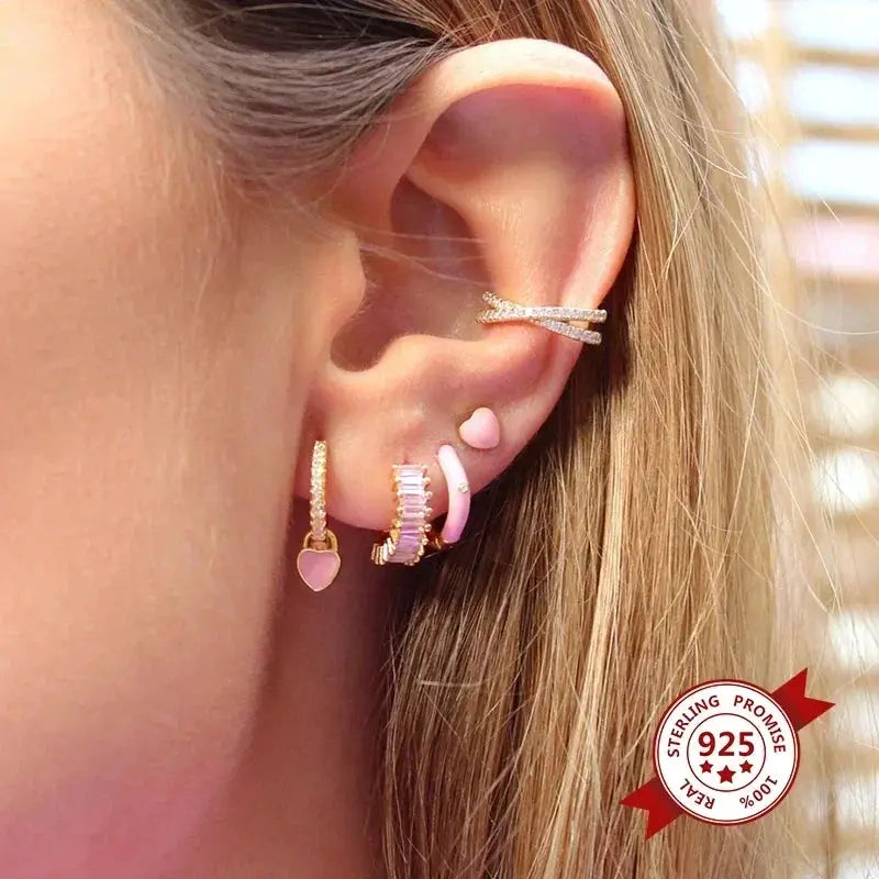 Sterling silver ear jewelry set with pink accents and zircon stones; multiple hoop styles on the ear
