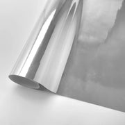 Stretchable silver chrome vinyl wrap roll for cars and motorcycles, reflective mirror finish.