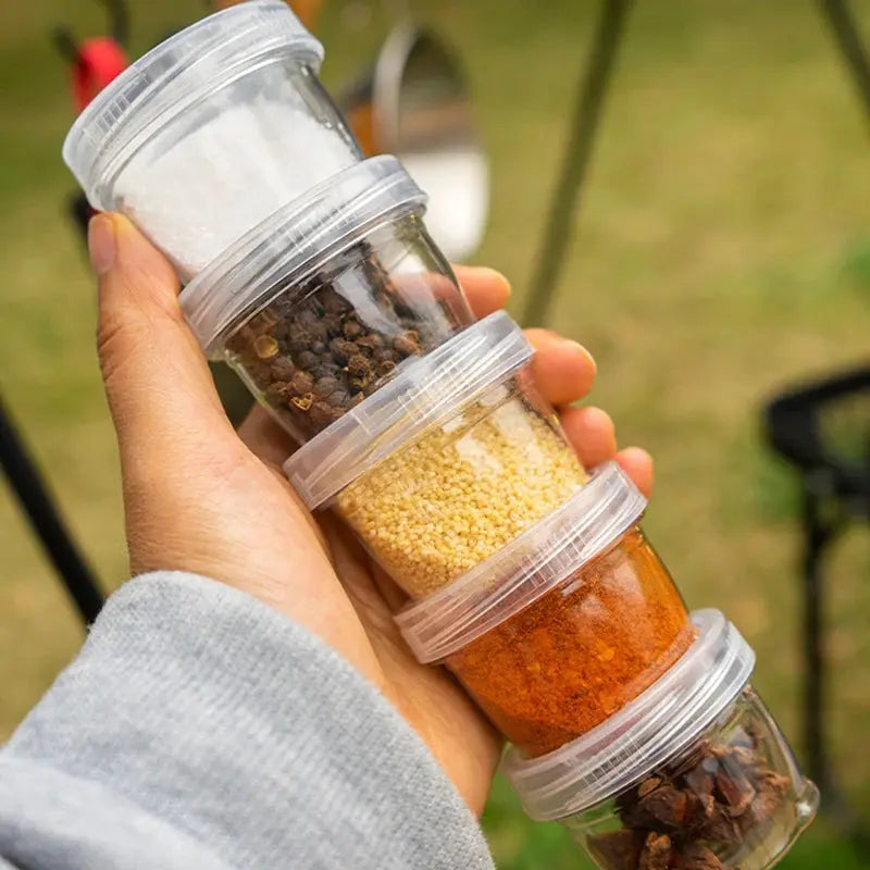 Camping spice container set, five clear stackable bottles for travel with assorted seasonings