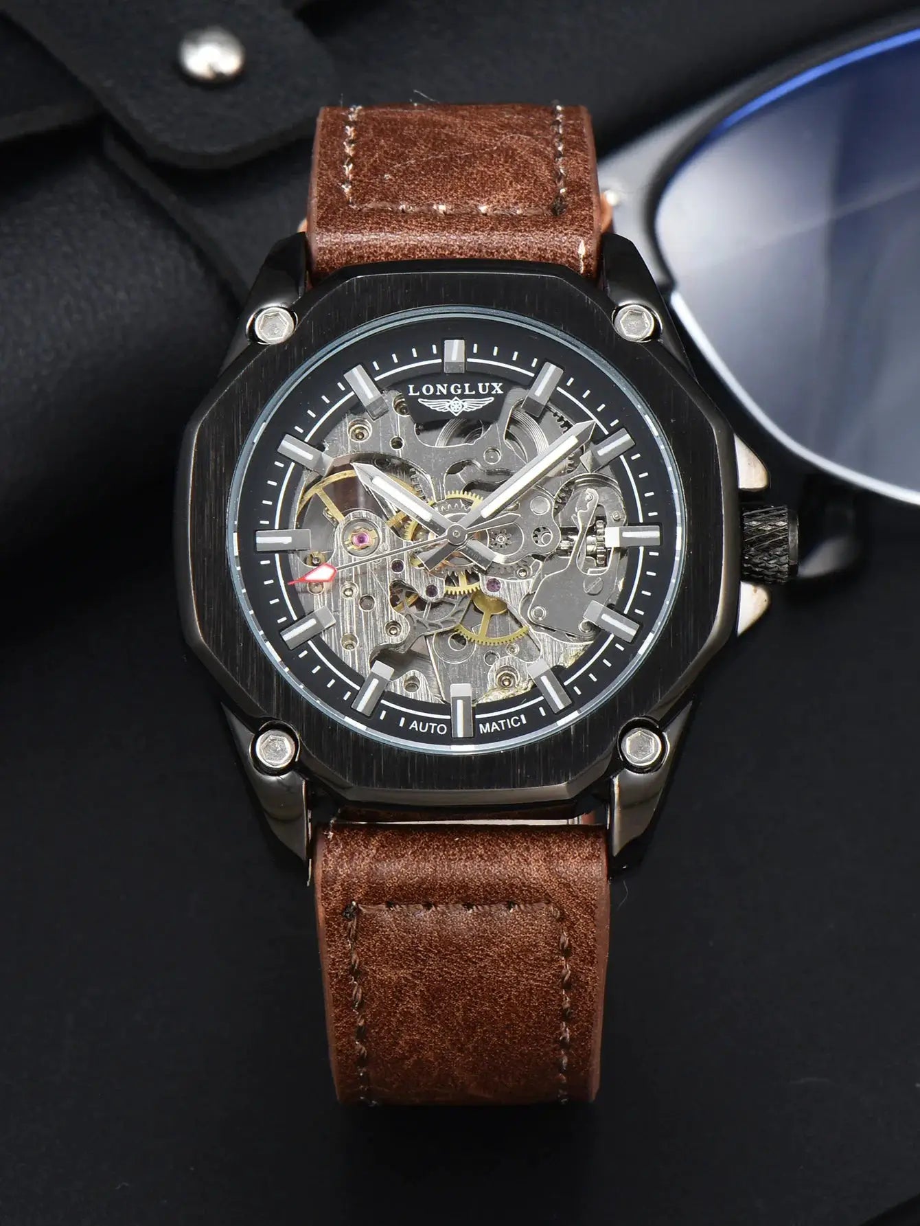 LongLux men's skeleton automatic wristwatch with brown leather strap and black case.