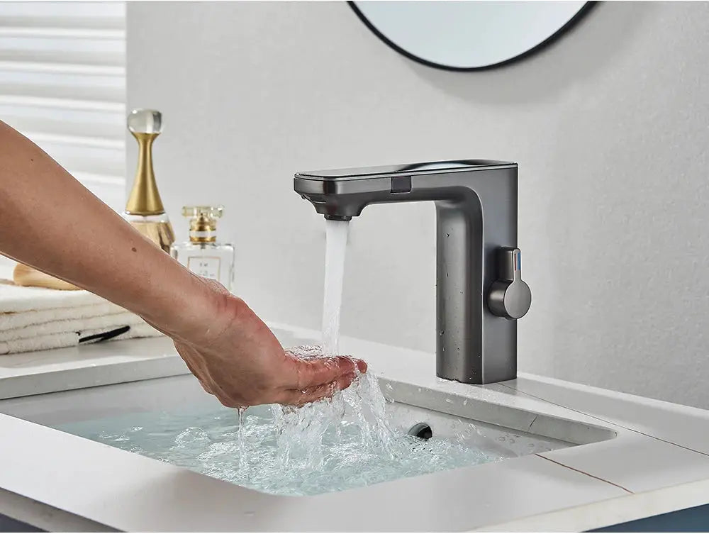 Simples Market smart sensor basin faucet in dark metallic finish with touchless operation.