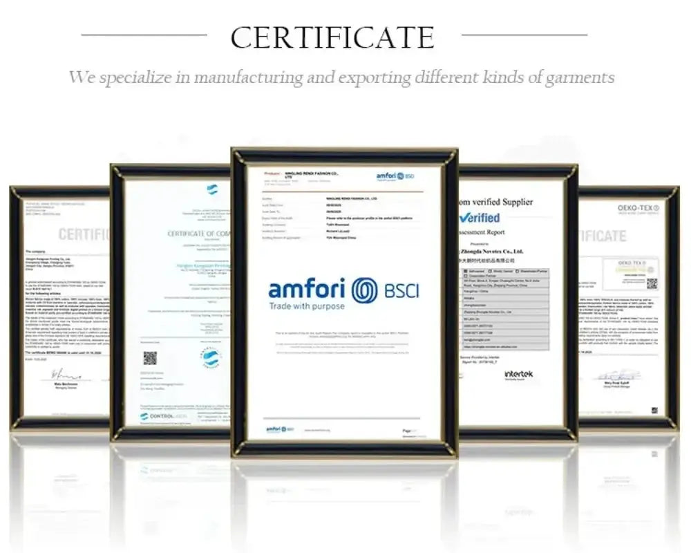 Five framed certificates on a white surface, black frames with gold trim and a reflective base