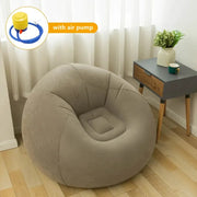 Large grey inflatable PVC sofa chair lounger by Simples Market in a modern living room, includes air pump.