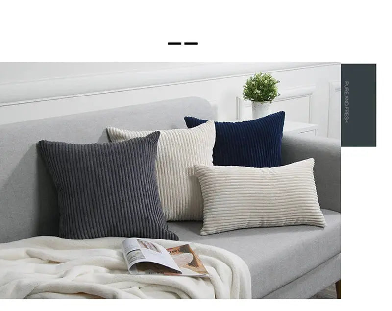 Corduroy striped cushion covers, 4 cushions, on a light gray sofa in navy, cream and gray