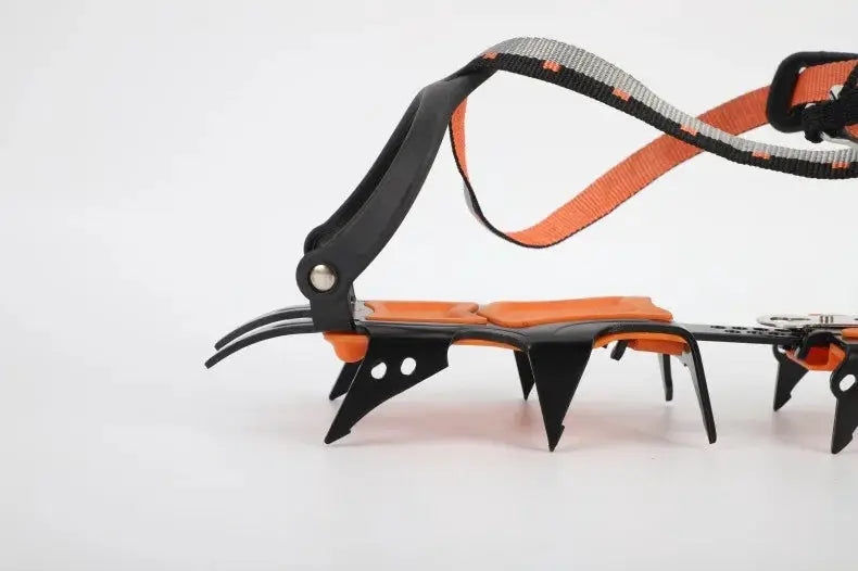 12-tooth ice crampons with orange and black straps and stainless steel spikes for anti-slip grip