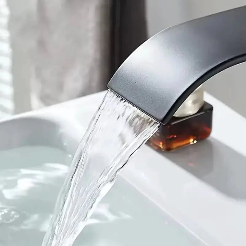 Waterfall wash basin faucet by Simples Market, stainless steel with black finish for hot and cold bathroom sink