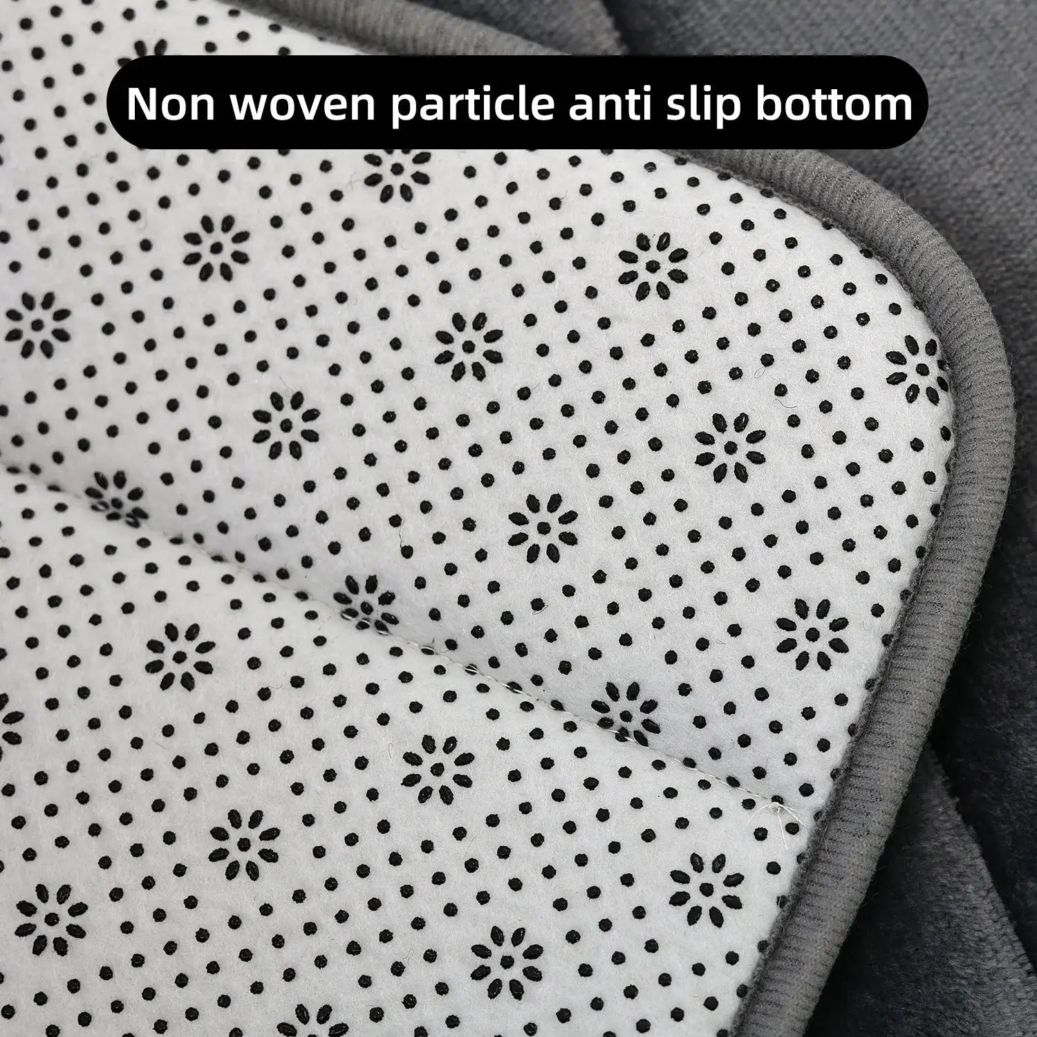 Coral velvet bathroom mat with black floral-dot pattern and gray edge trim