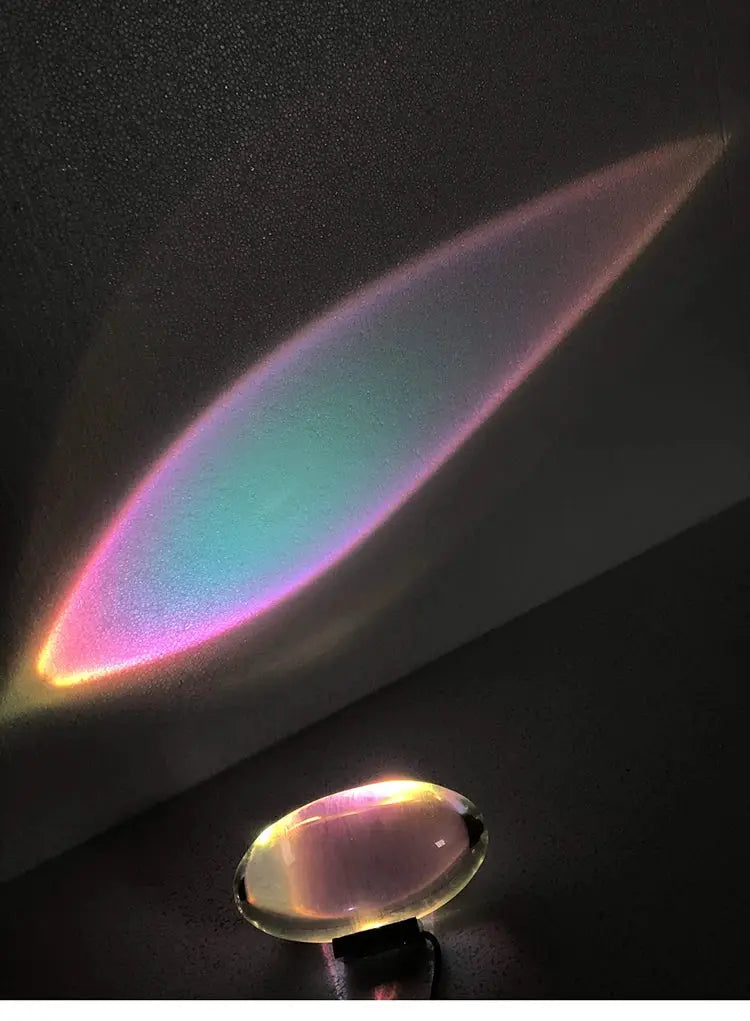Egg-shaped LED crystal table lamp by Simples Market with rainbow projection.