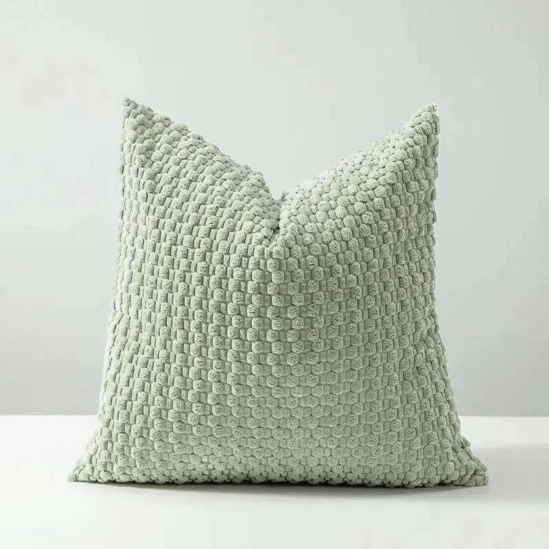 Cushion cover from Simples Market; soft velvet double-sided design in sage green with textured knit