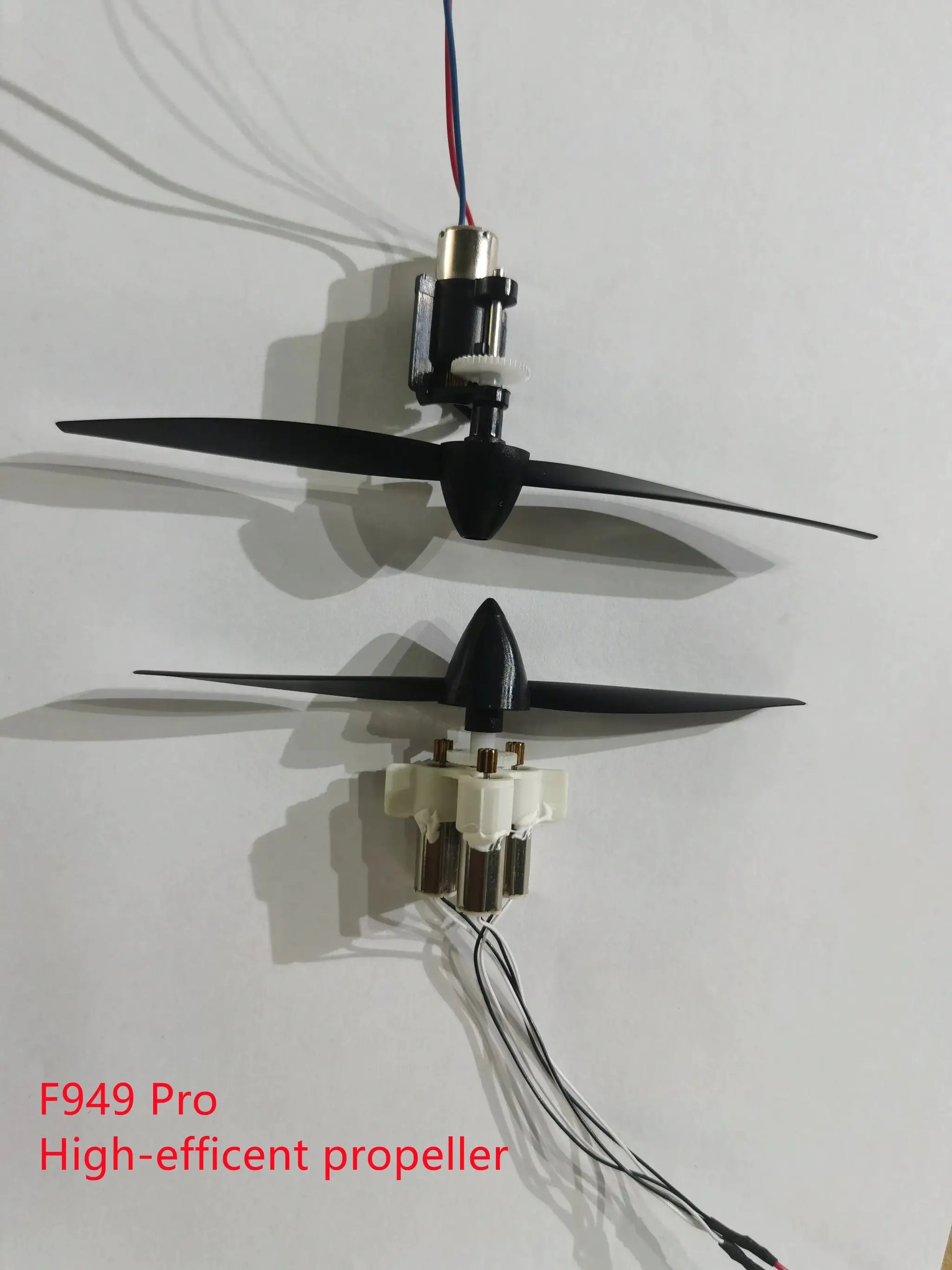 F949 Pro RC airplane propeller assembly with black blades and white gear housing