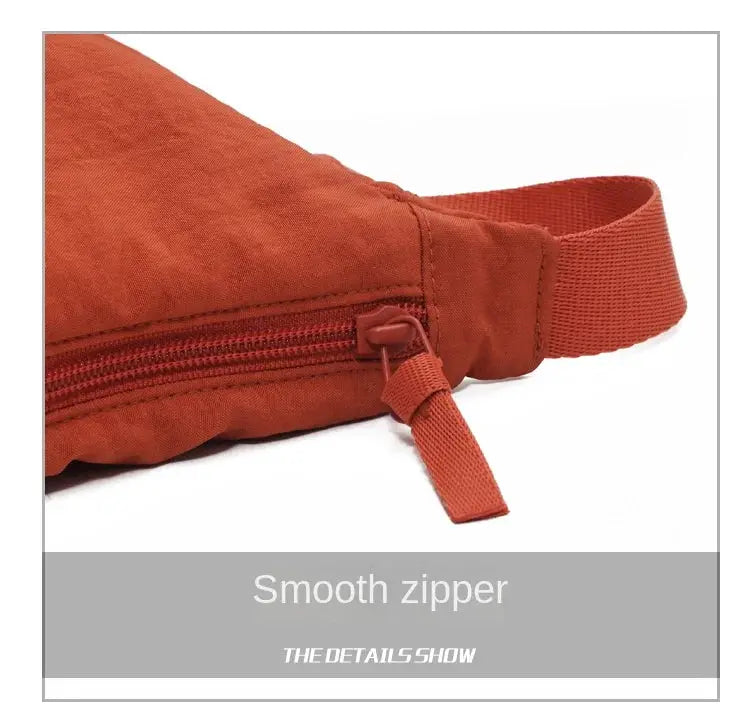 Simples Market nylon hobo crossbody bag in orange with smooth zipper and adjustable strap