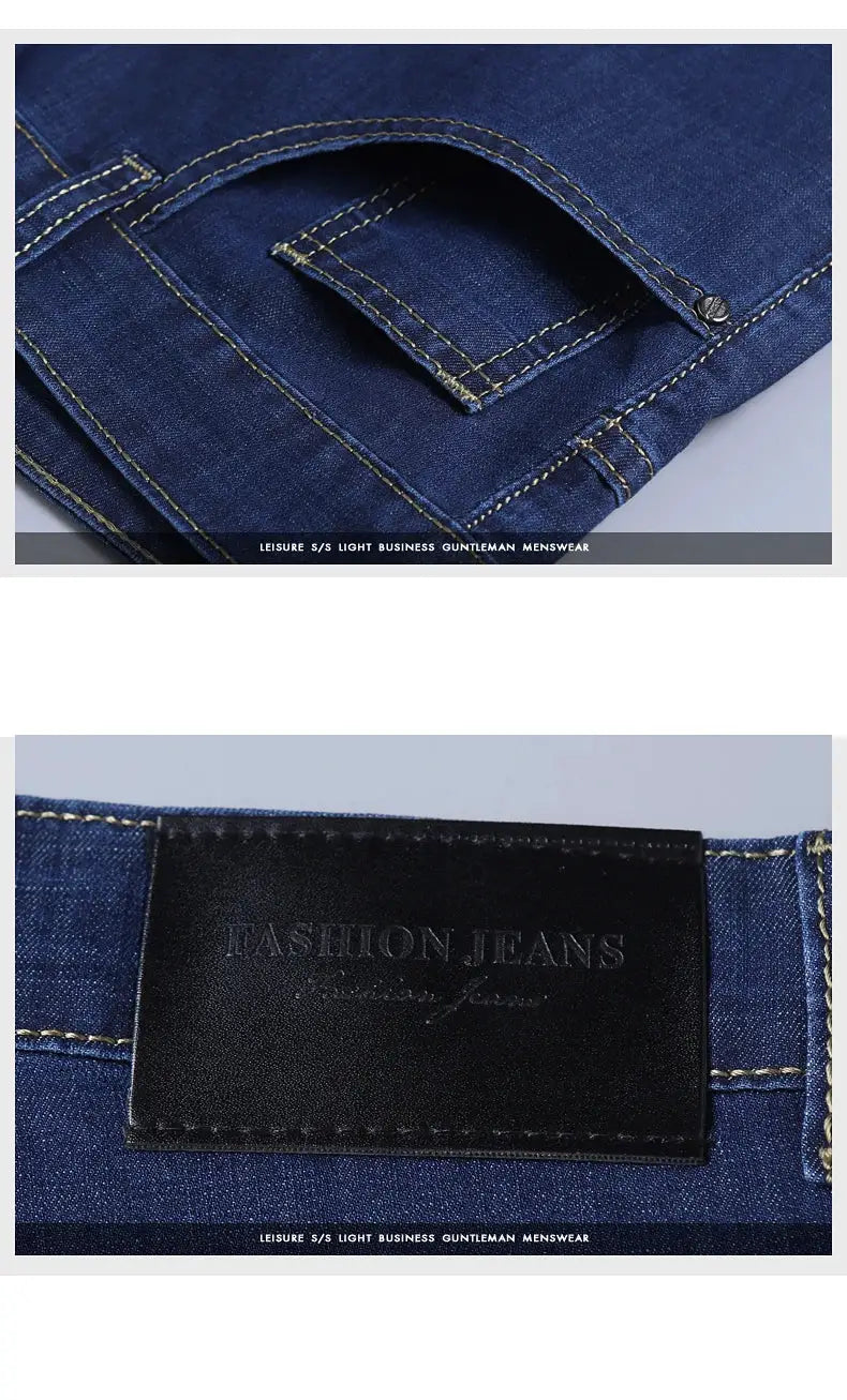 Men's blue denim jeans with front pocket stitching and a black leather patch reading FASHION JEANS on the waistband