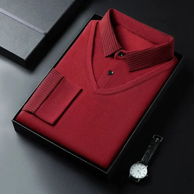 Red men's long-sleeve polo shirt in a gift box with a black-strap wristwatch beside