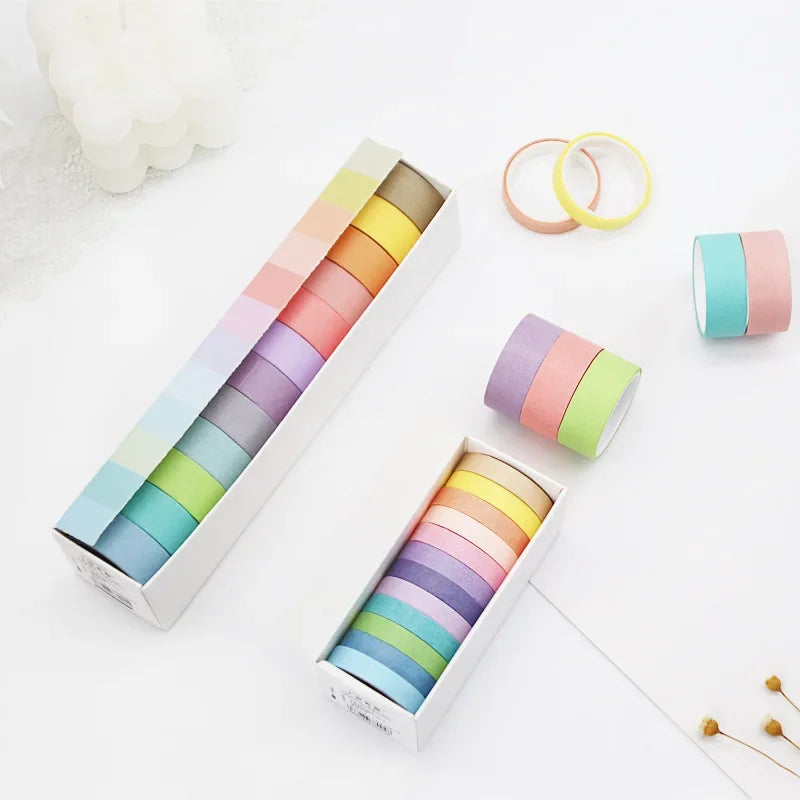 Two boxes of rainbow washi tape by Simples Market; 6/12 rolls per box in pastel macarons for DIY scrapbooking