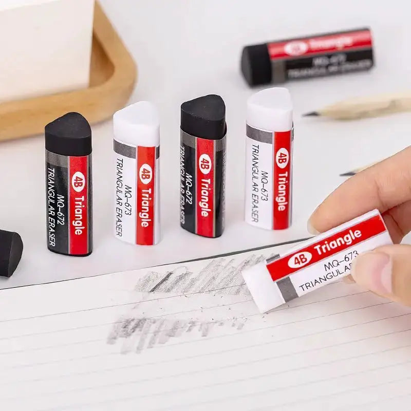 4B Triangle erasers, six-piece set in red and black wrappers; one eraser being used on lined notebook paper.