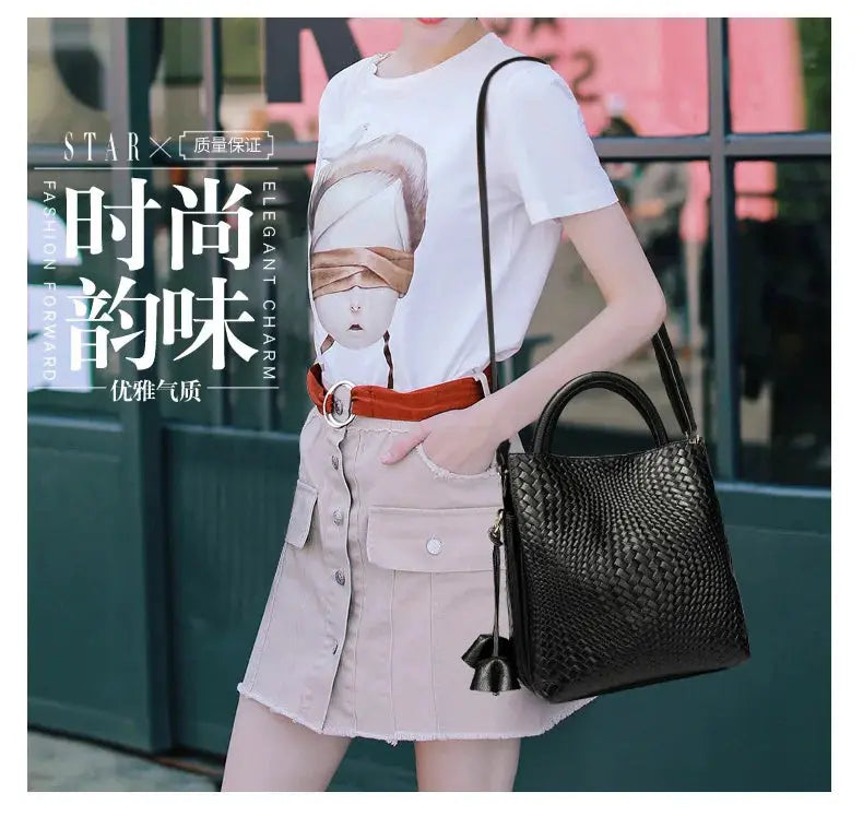 Simples Market women's black woven cowhide handbag with top handles and long crossbody strap