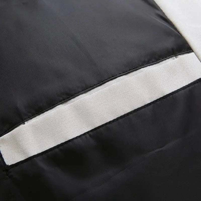 Men's black puffer jacket with a white stripe across fabric