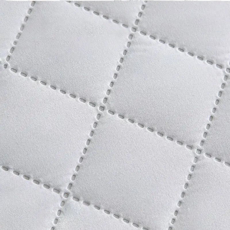 Ultrasonic mattress protector cover pad in white quilted fabric with grid stitching
