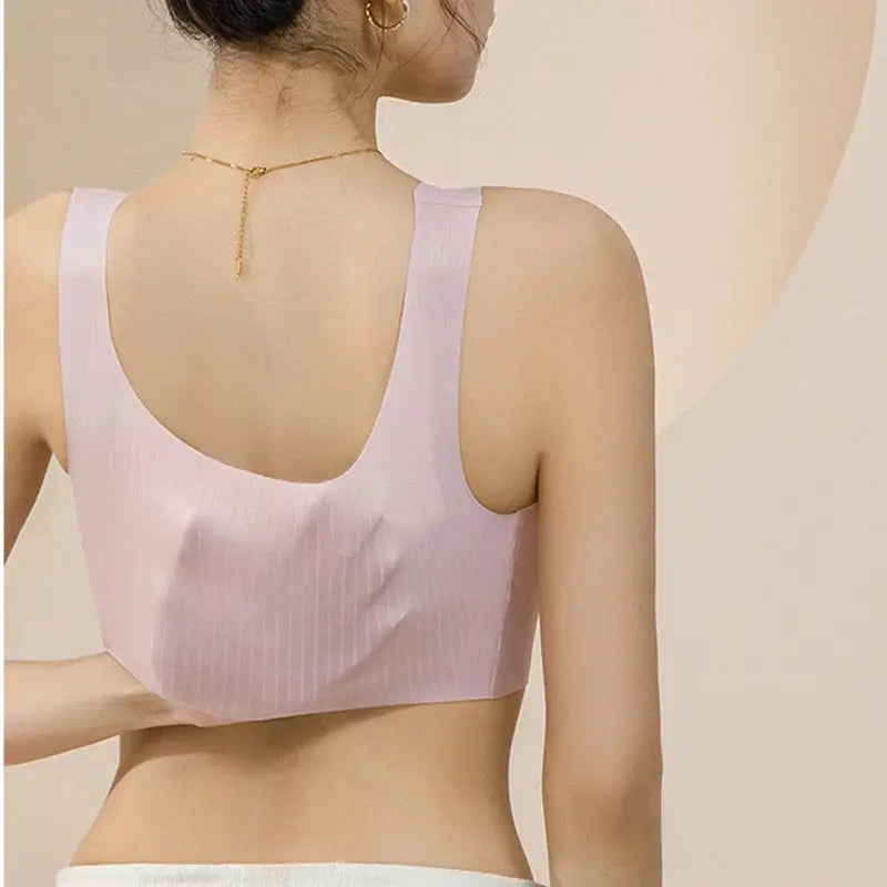 Pink ribbed soft-knit one-piece sleep bra with wide straps, U-shaped back, and smooth seamless fit daily.