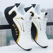 Pair of Simples Market men's PU leather waterproof sneakers, white with black and gold accents