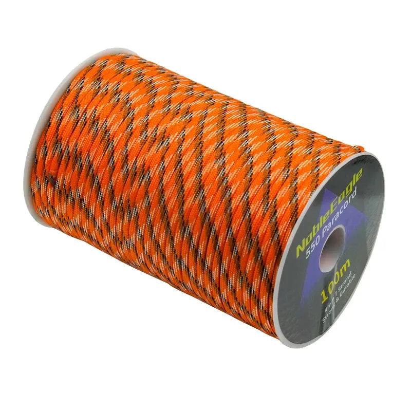 Military 550 Paracord rope on a spool, bright orange with black/white tracer, 100m length
