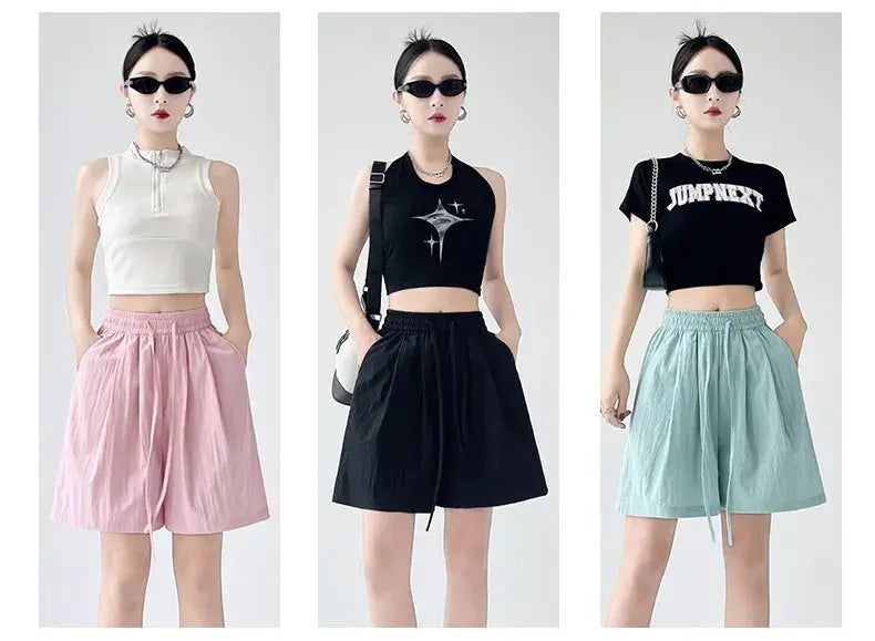 Summer women's shorts in three color variants pink, black, and light blue with two pockets and high-waist loose fit