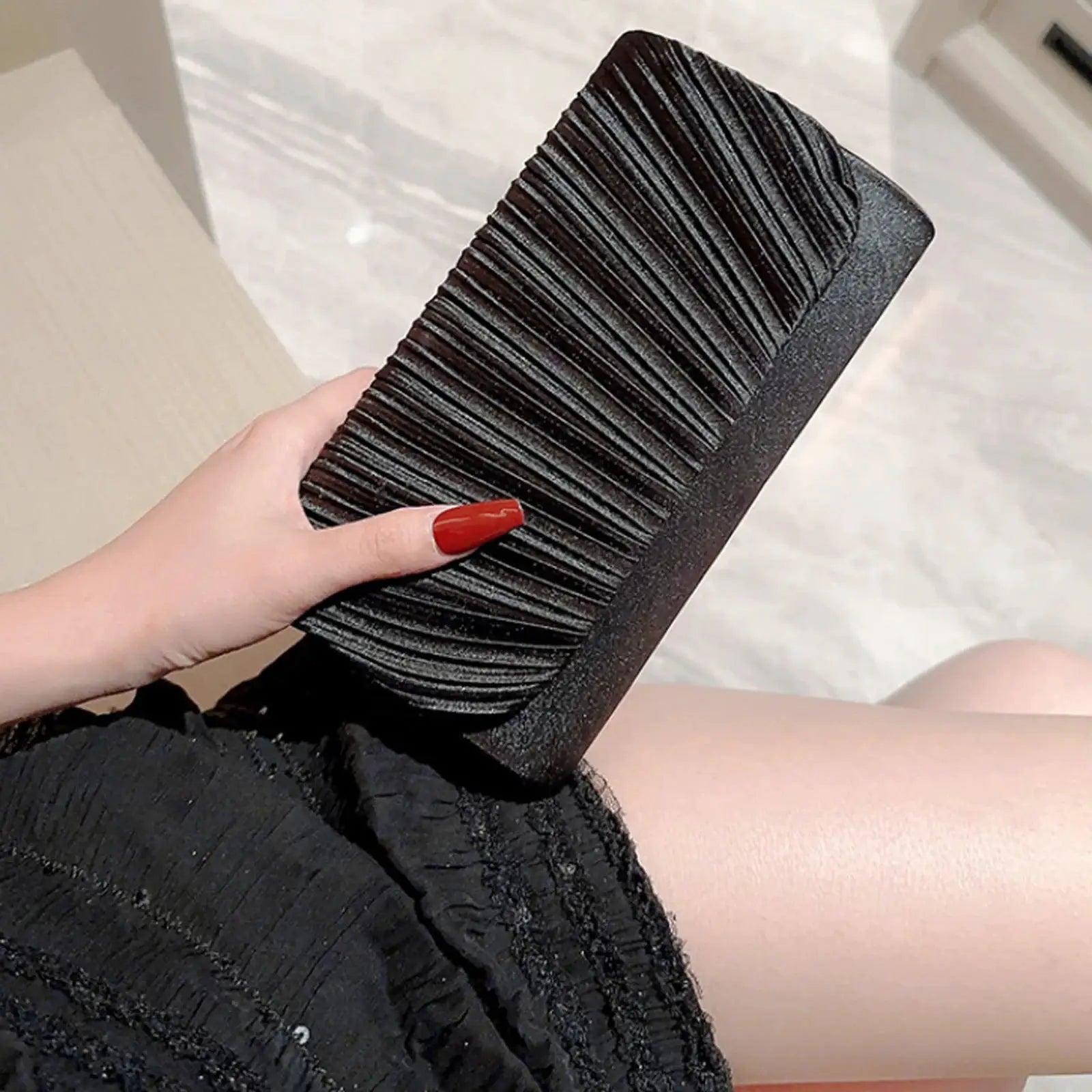 Evening clutch bag in black with pleated textured faux leather
