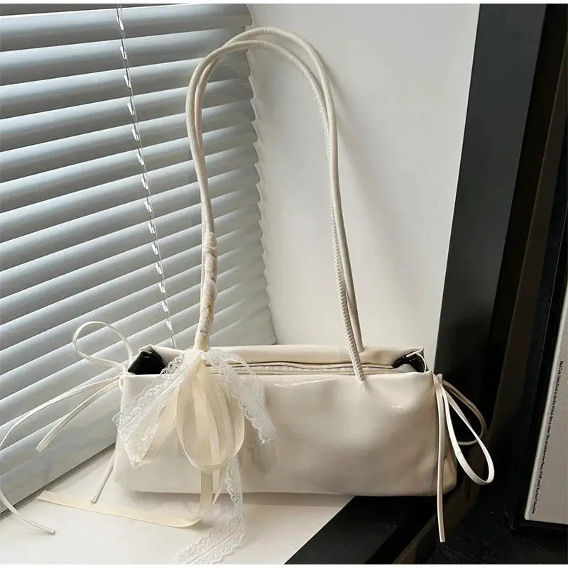 Square shoulder bag by Simples Market, cream PU leather with delicate lace bow.