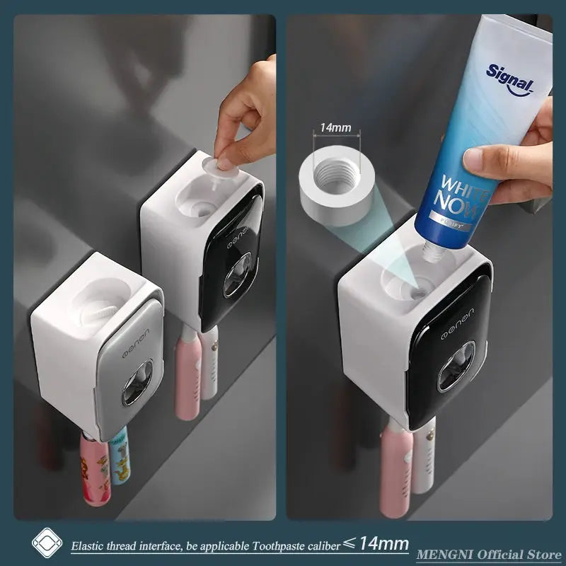 Two white wall-mounted toothpaste dispensers with an integrated toothbrush holder rack; black front panels.