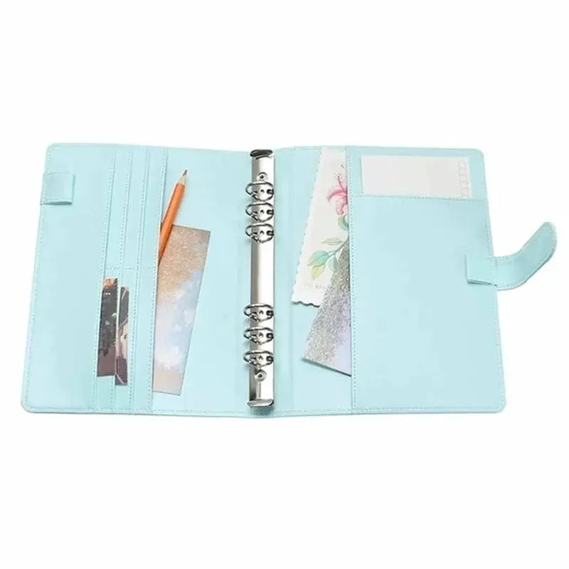 Leather ring binder notebook cover by Simples Market in light blue with card slots and pockets.