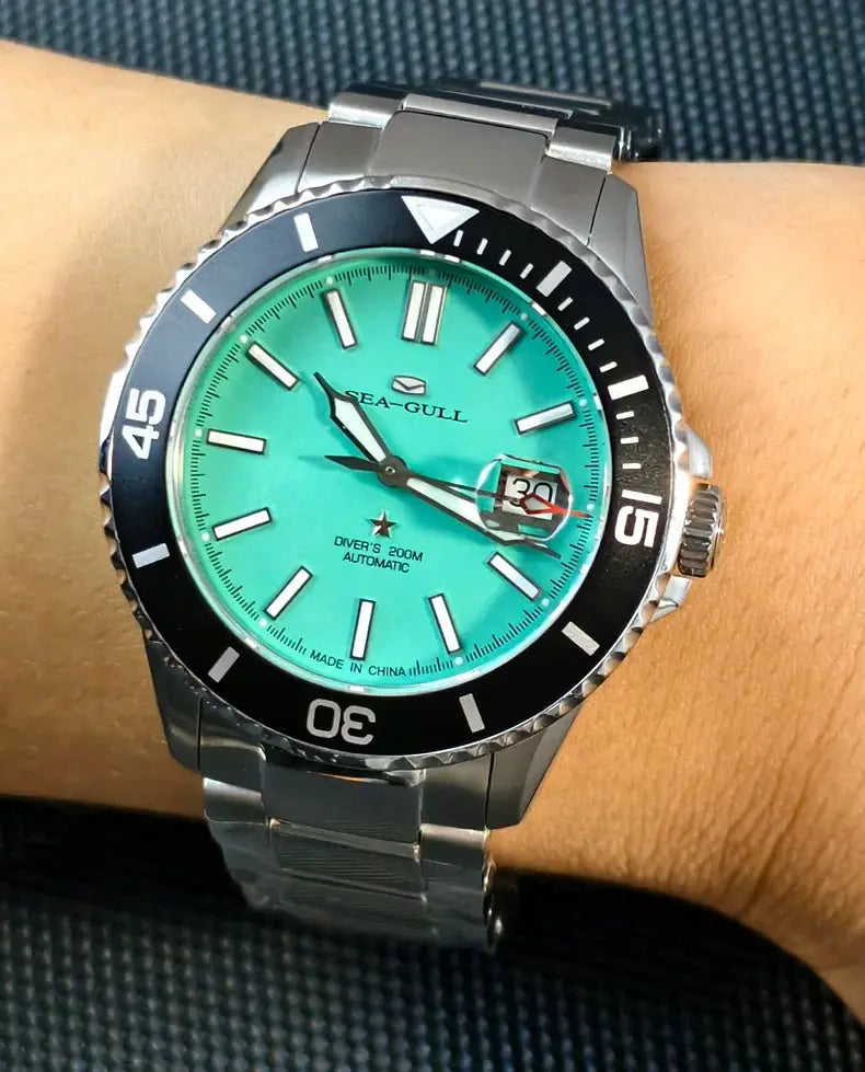 Sea-Gull men's dive watch on metal bracelet with turquoise dial and bezel, automatic movement, 200m water resistant