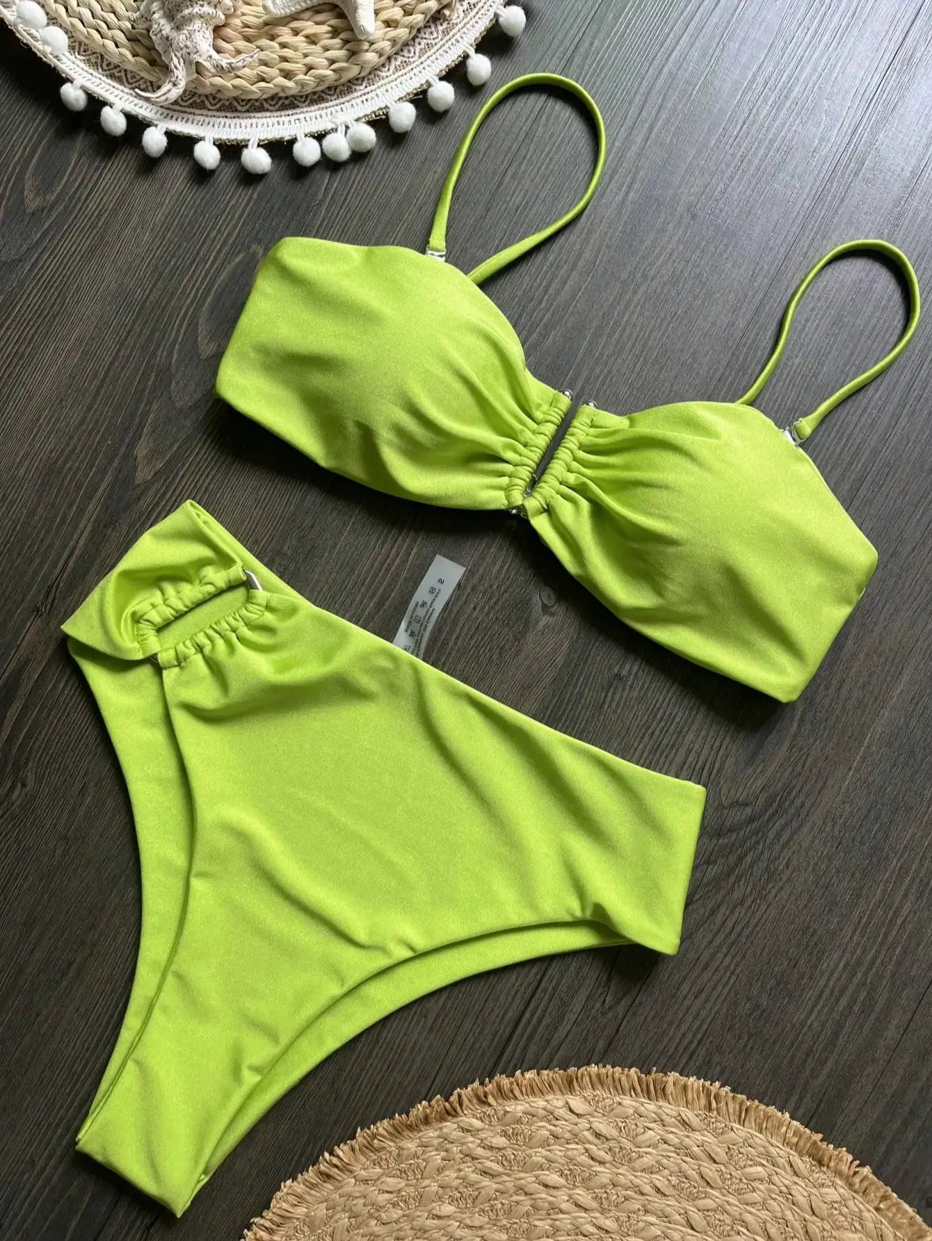 Two-piece lime green bandeau bikini with ruched center, adjustable straps, solid beachwear set