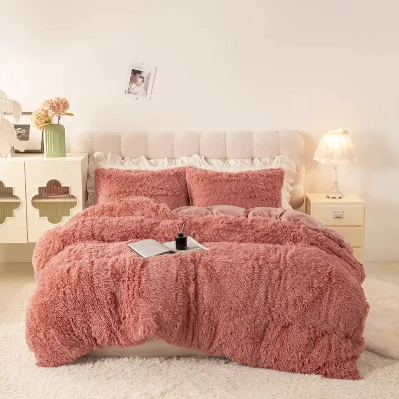 3-Piece Plush Duvet Cover Set by Simples Market in pink fluffy fabric on a cozy bed with pillows