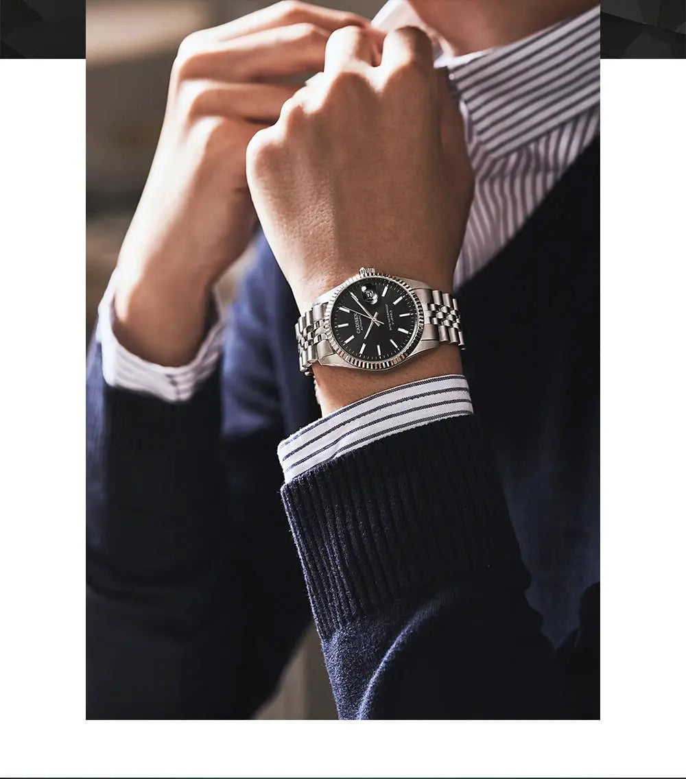 CADISEN men's stainless steel automatic watch with black dial and silver bracelet on wrist