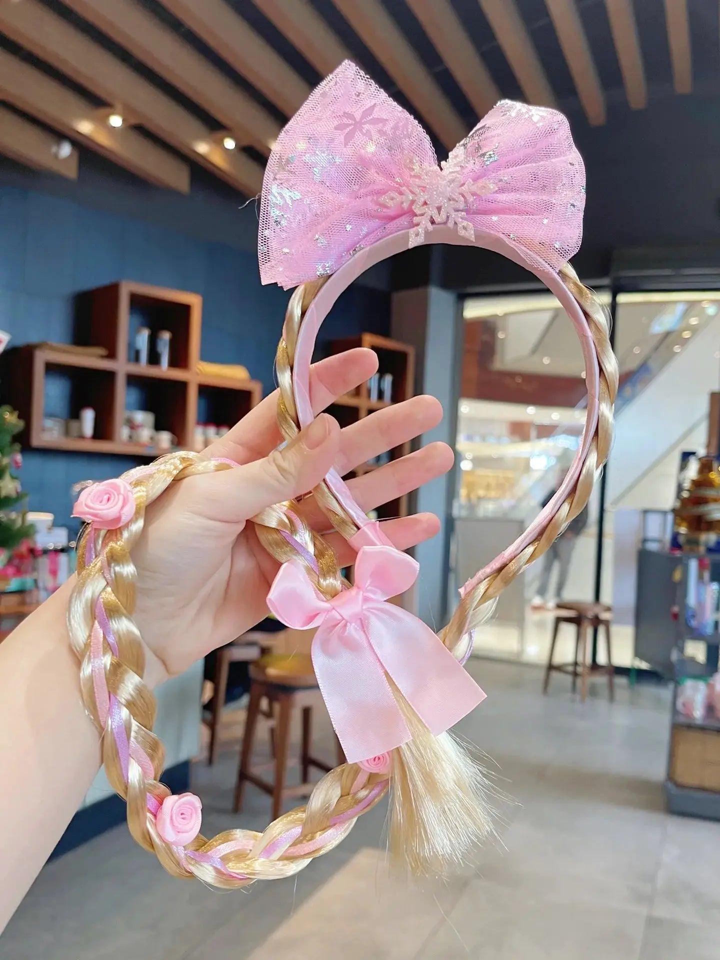 Elsa princess headband with pink mesh bow, snowflake accents, braided blonde strands and pink ribbons