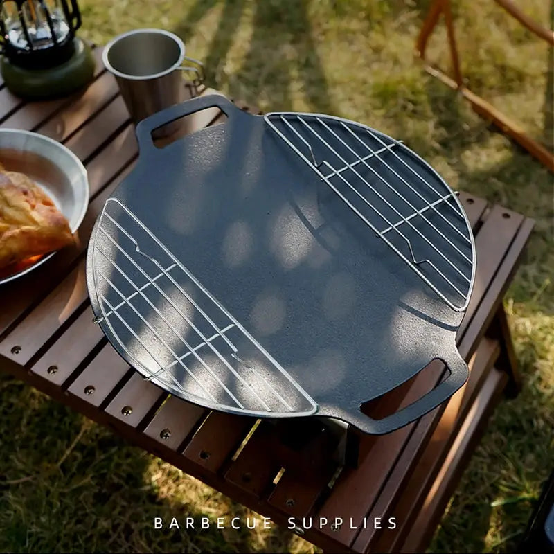 Round grey stainless steel outdoor barbecue grill with dual side racks for camping