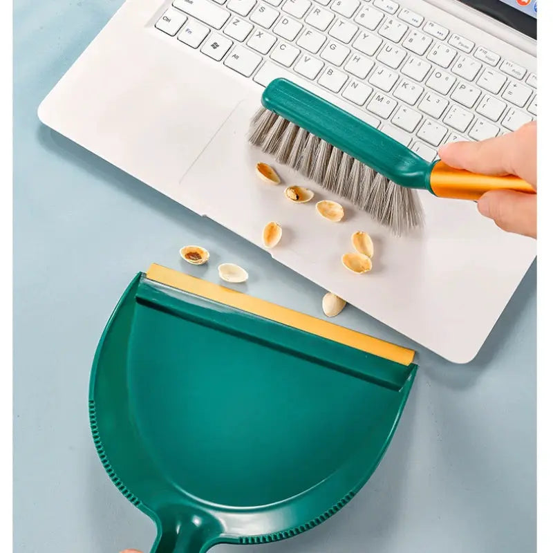 Desktop broom set with green plastic dustpan and compact green-bristle broom