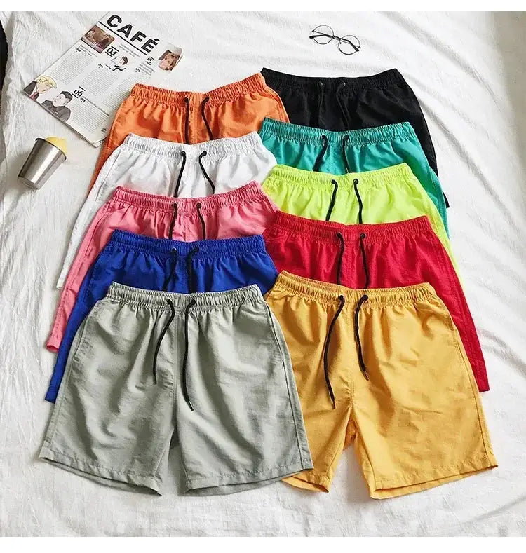 Men's swim trunks: 10 colorful shorts in orange, black, white, teal, pink, lime, royal blue, red, gray, and mustard