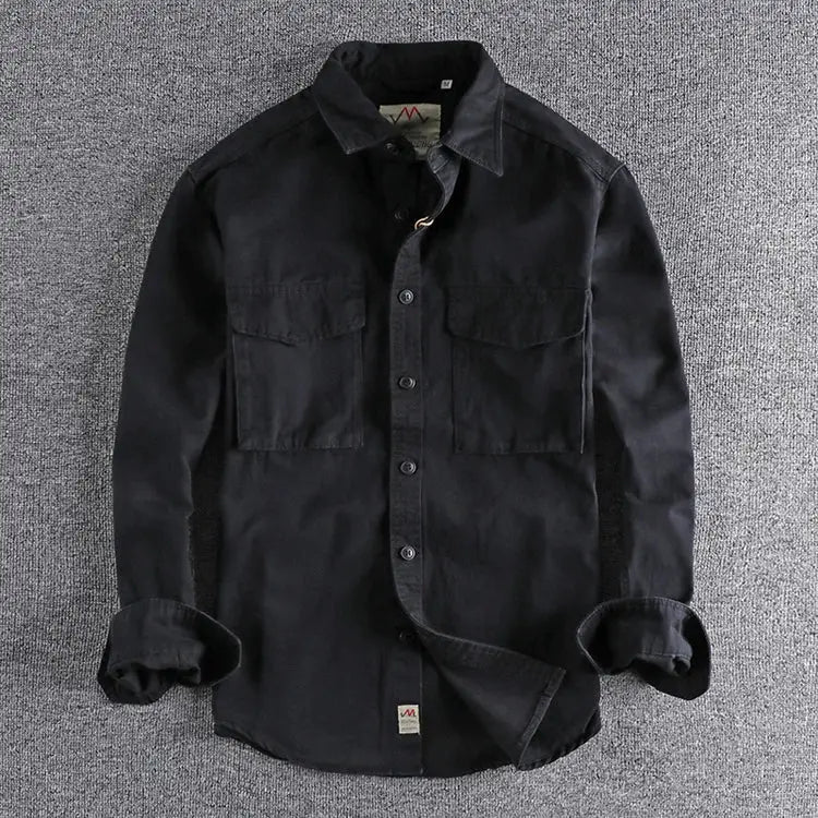 Men's black work shirt with two chest pockets and button front