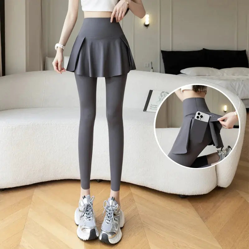 Women's grey high-waist fake two-piece leggings with skirt overlay and phone pocket by Simples Market