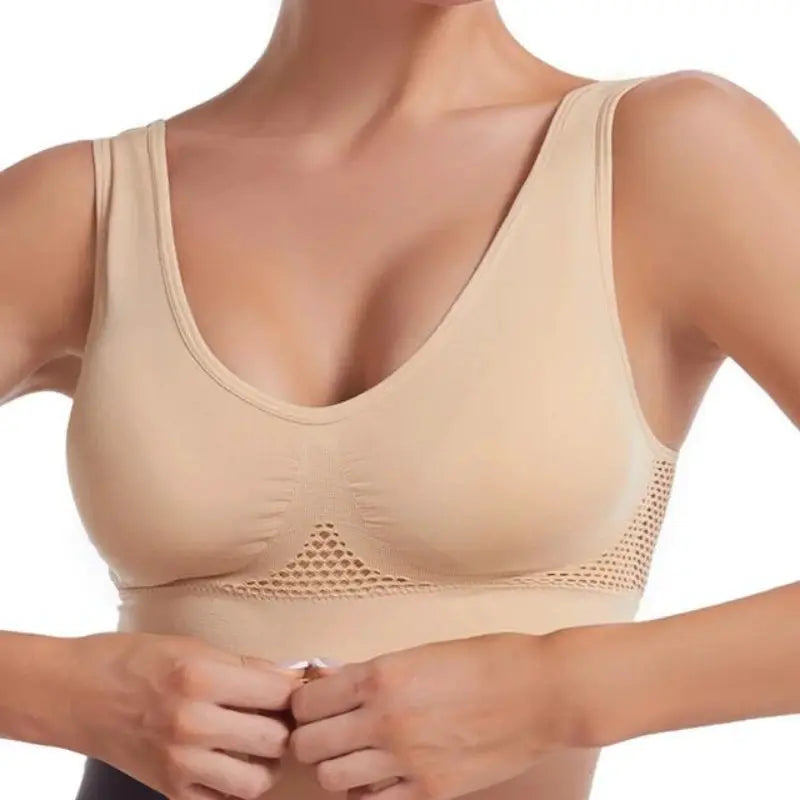 Plus-size wireless sports bra in nude beige with grid air holes and breathable mesh band