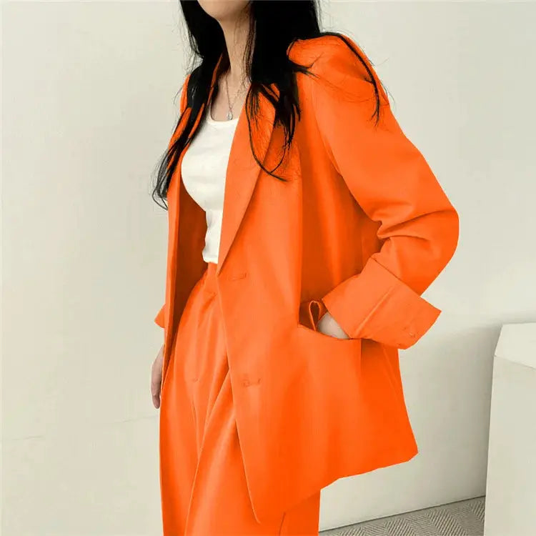 Women's orange blazer and pants 2-piece set by Simples Market; long-sleeve blazer with matching pants.
