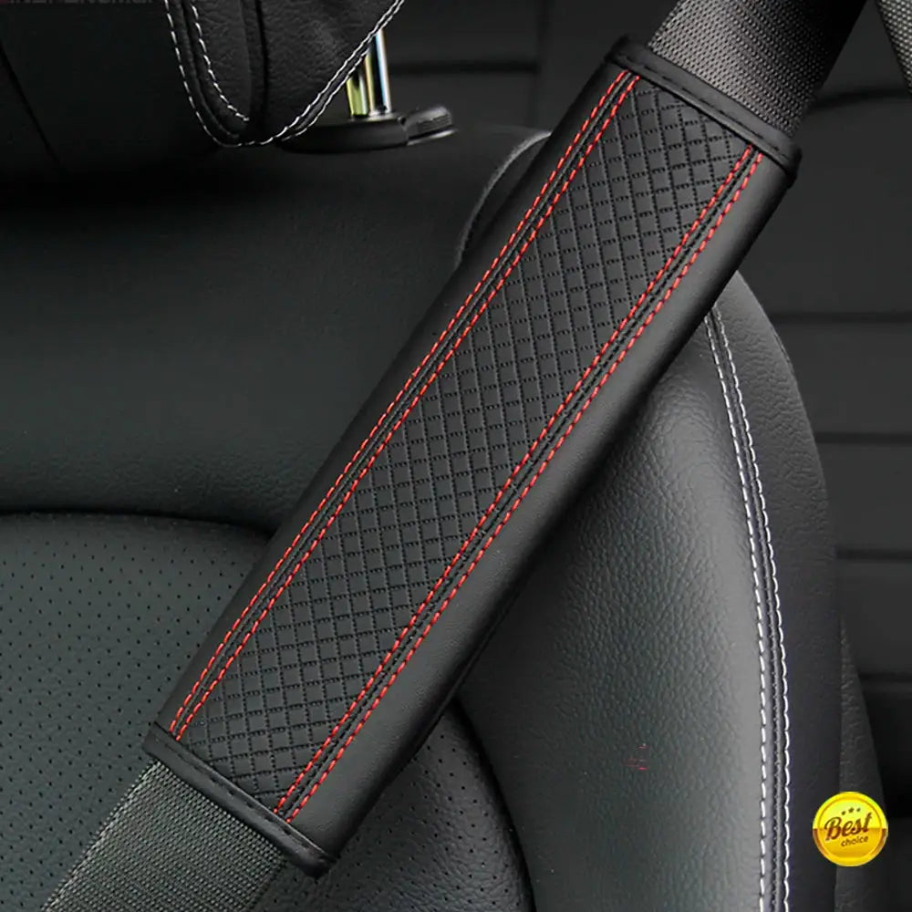 Seat belt shoulder pad in black PU leather with diamond embossing and red contrast stitching
