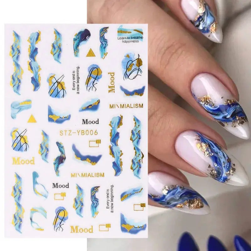 Nail art decals sheet featuring blue marbled stripes with gold foil accents for geometric lines and flowers.
