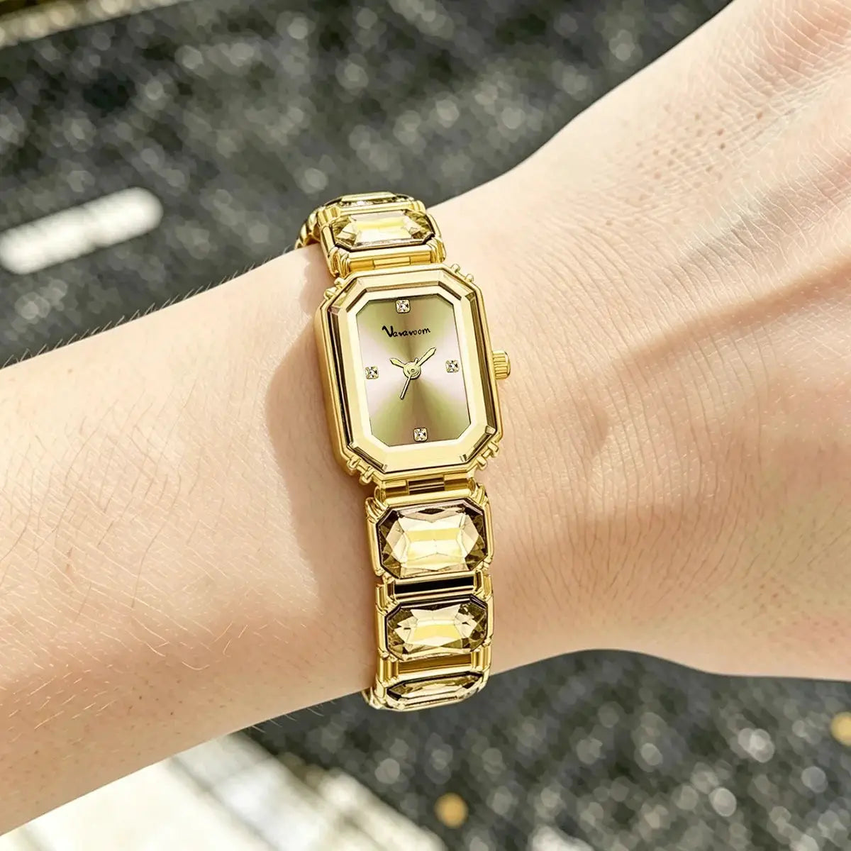 Women's square rose-gold watch with crystal accents and crystal-link bracelet.